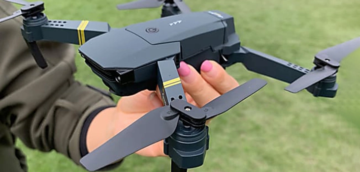 woman with pink nails holding Stealth Drone 4K